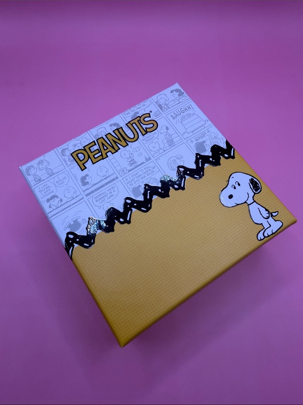 Peanuts box on pink background